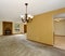 Cozy unfurnished living room with carpet, and fireplace.