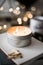 Cozy warm home decoration with burning candle and bokeh lights