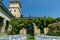 Cozy wedding ceremony with a flower arch and wooden white chairs in an Italian villa. Without people