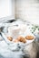 Cozy weekend breakfast with cup of coffee and cookies on ceramic tray