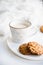 Cozy weekend breakfast with fur blanket, cup of coffee and cookies on ceramic tray