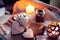 Cozy winter with candles and cup of coffee with marshmallow and ginger snap in the shape of heart. Still life for St. Valentine`
