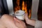 A Cozy Winter Indulgence: Woman\\\'s Delightful Espresso Coffee by the Fireplace