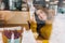 Cozy winter portrait of young smiled woman in window comfortable cafe in big city. Chilling inside in cold winter