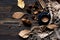 Cozy winter relax time.  Cup of hot coffee  with blanket, autumn leaves, cinnamon sticks item brown on the old wood background in