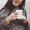 Cozy young woman enjoy morning coffee