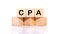 CPA, the concept of the Federal Reserve System, a cubic wooden block with the alphabet building the word CPA