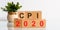 CPI 2020 - acronym from wooden blocks with letters, abbreviation CPI Consumer price index concept, gray background