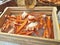 Crab on ice in wooden bucket