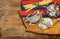 Crab , seafood with spaghetti and shells on ethnic fabric and wooden board