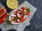 Crab sticks, lemon snack  seafood   cuisine   on concrete background parsley organic