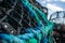 Crab trap cages in piles, blue rope closeup, dirty cages used to catch large numbers of crabs in Mudeford Quay UK, sea