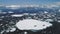 Crabeater seal family lies iceberg aerial view