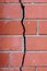 Crack in the brick wall, signs of deformation of the building