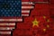 The crack between the flags of America and China close-up