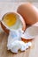 Cracked boiled eggs on wooden table