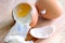 Cracked boiled eggs on wooden table