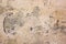 Cracked concrete vintage wall background,old dry damaged wall. Texture of old plaster wall rusty old-fashioned with space for your