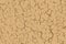 Cracked dry soil beige and brown seamless texture