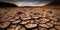 A cracked earth landscape, depicting the devastating consequences of drought and desertification, concept of