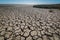 Cracked earth, silt at low tide at sea