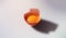 Cracked Egg with Bright Yolk on Minimalist Background