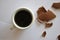 Cracked Eggs chocolate and cup of coffee. Espresso. White background.