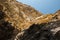 Cracked, fragmented limestone rock against blue sky