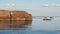 Cracked granite boulder with seagull on it. Baltic sea, gulf of Finland