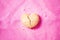 Cracked heart shaped cookie on creased background