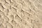 Cracked sandy desert ground background