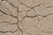 Cracked sandy soil background