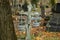 Cracked stone Christian cross in an Orthodox cemetery in autumn