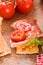 Crackers with ham and tomato.