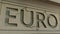 Cracking EURO word on the stone facade. European financial crisis conceptual 3D rendering