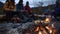 A crackling bonfire warms a group of hikers as they relax after an evening walk snacking on warm apple pie and hot cocoa