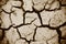 Cracks of the dried soil in arid season / Arid soil , Cracked earth texture of ground broken and rough surface mud clay