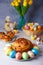 Craffin (Cruffin) with raisins and candied fruits. Traditional Easter Bread Kulich and painted eggs.