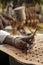 Craft artist making traditional buffalo leather carving art in indonesia