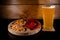 Craft beer glass with mix snack plate on  wooden background