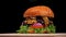 Craft burger is cooking on black background. Consist: sauce, arugula, tomato, onion, bacon, currant sauce, ricotta