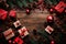 Craft a charming Christmas background concept with a top view arrangement of festive elements: Christmas gift boxes, red balls,