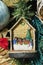 Craft decorations for Christmas tree, traditional wooden house with birth of Jesus, with recycled materials