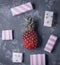Craft paper present boxes with red pineapple, color filters in soft color