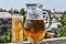 Crafting a beer in a jug and a glass. Summer time.