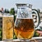 Crafting a beer in a jug and a glass. Summer time.