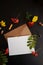 Crafting envelope and clean postcard, stationery card mockup among aesthetic autumn flowers and leaves. Atmospheric