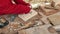 A craftsman carved a baking dish gingerbread and cookies out of wood with a knife. Art wood carver makes wood carvings