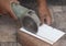 Craftsman cutting ceramics using a cutting machine