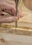 Craftsman cutting a dovetail joint with a chisel